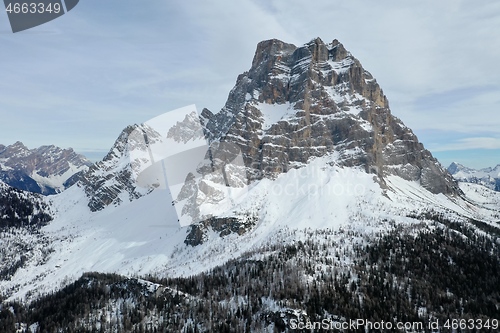 Image of aerial snow covered mountain peaks in alps at winter 