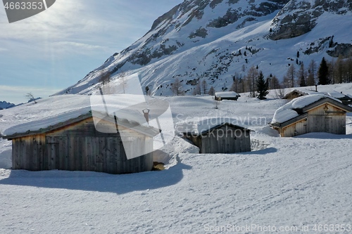 Image of aerial snow covered mountain peaks in alps at winter 