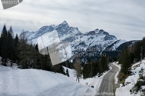 Image of aerial snow covered mountain peaks in alps at winter 