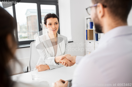 Image of recruiters having interview with female employee