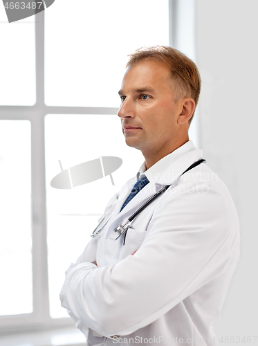 Image of smiling doctor in white coat at hospital