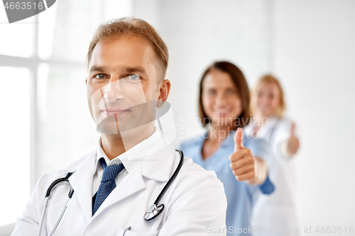 Image of smiling doctor in white coat at hospital