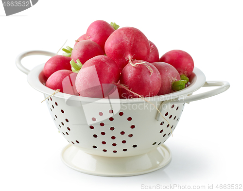 Image of fresh ripe radish in white colander