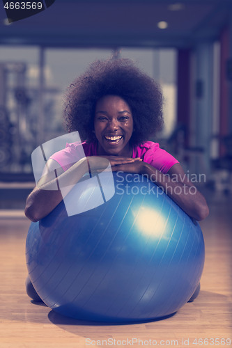 Image of woman  relaxing after pilates workout