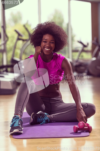 Image of african american woman exercise yoga in gym