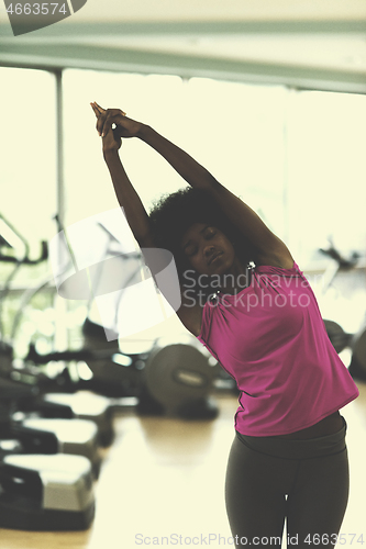 Image of african american woman exercise yoga in gym