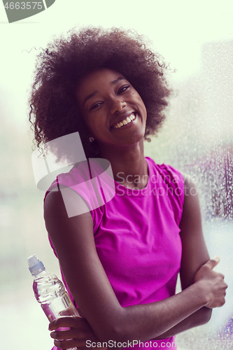 Image of portrait of young afro american woman in gym