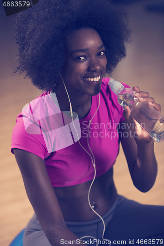 Image of woman  relaxing after pilates workout