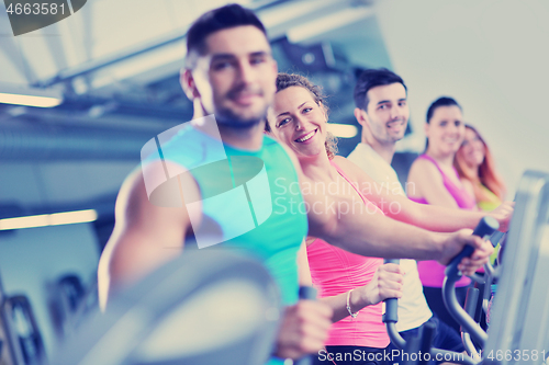 Image of Group of people running on treadmills