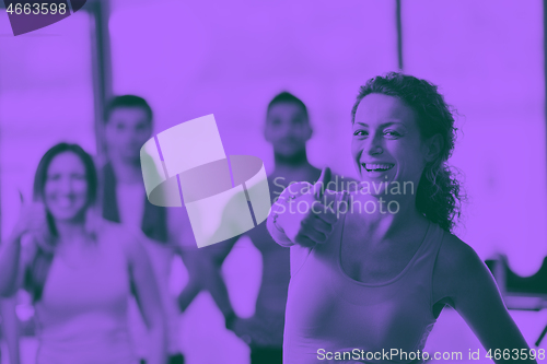 Image of Group of people exercising at the gym