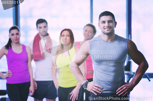 Image of Group of people exercising at the gym