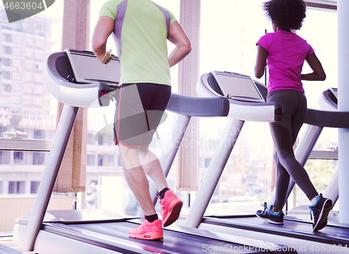 Image of people exercisinng a cardio on treadmill in gym