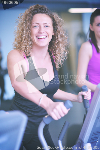 Image of woman exercising on treadmill in gym