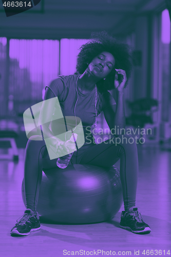 Image of woman  relaxing after pilates workout