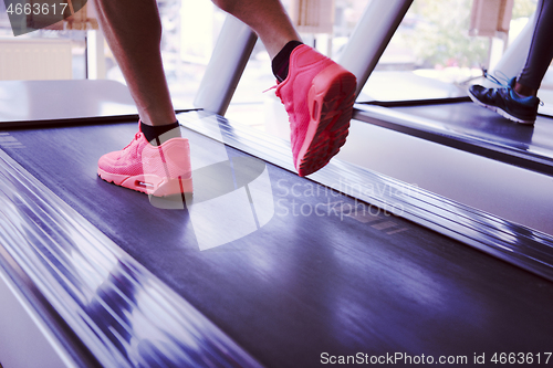 Image of sportsman exercise jogging on treadmill