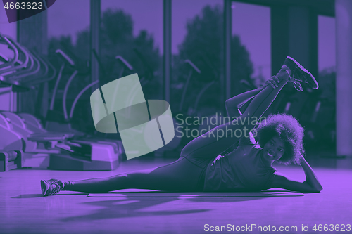 Image of african american woman exercise yoga in gym