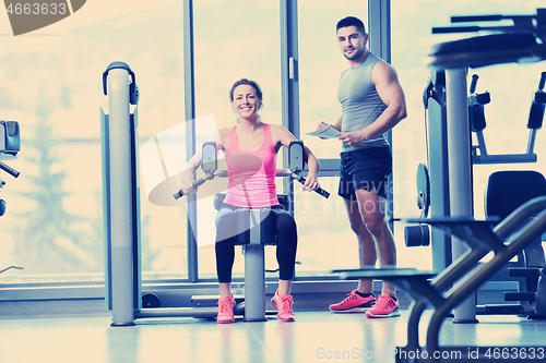 Image of woman exercising with her personal trainer