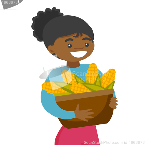 Image of A black happy woman with a basket of corncobs.