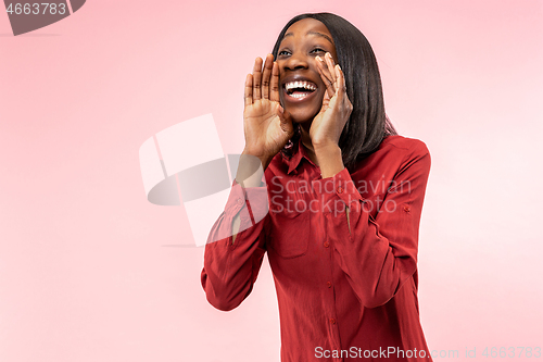 Image of Isolated on pink young casual afro woman shouting at studio