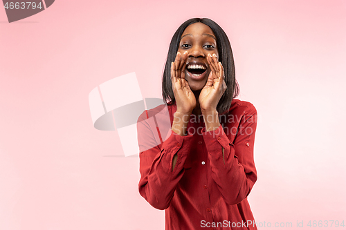 Image of Isolated on pink young casual afro woman shouting at studio