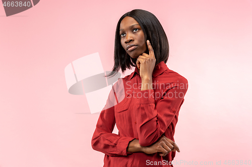 Image of Young serious thoughtful business woman. Doubt concept.