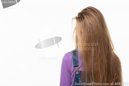 Image of Teen girl covered her face with long hair