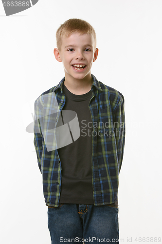 Image of Portrait of a cheerful young man of eleven years on a white background