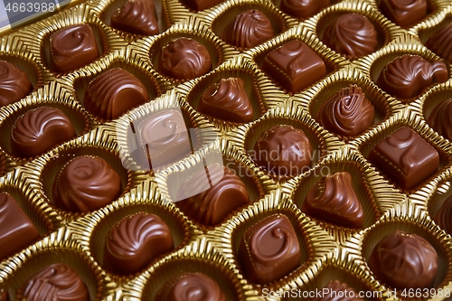 Image of Open box of chocolate treets