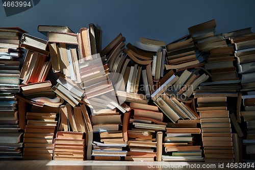 Image of Wall of books piled up in the attic