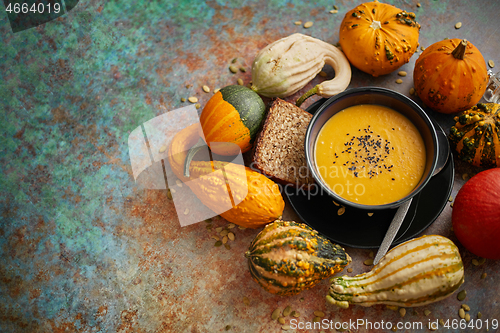 Image of Compositon with autumn classic food. Tasty homemade pumpkin soup