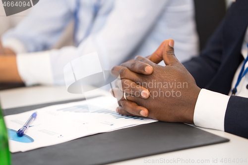 Image of hands of businessman at business conference