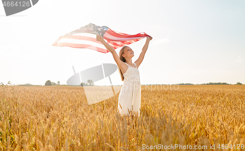 Image of girl with american flag waving over cereal field