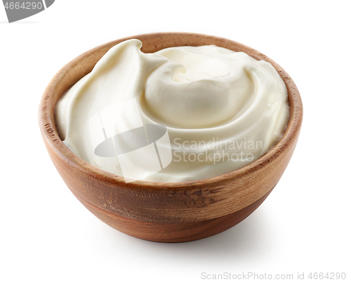 Image of sour cream yogurt in wooden bowl