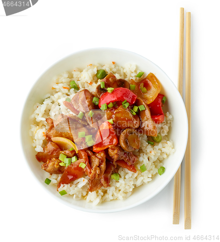 Image of fried rice and vegetables with hot chicken sauce