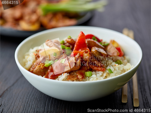 Image of fried rice and vegetables with hot chicken sauce