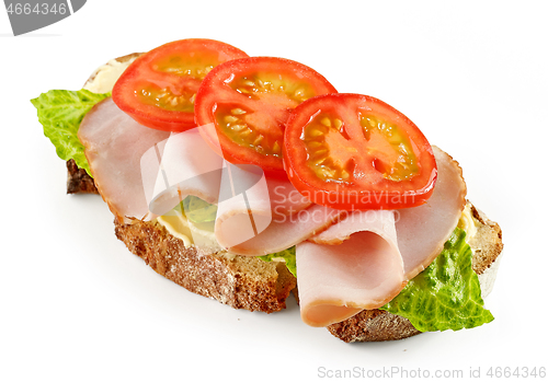 Image of slice of bread with ham and tomato