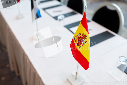 Image of flags at international conference boardroom