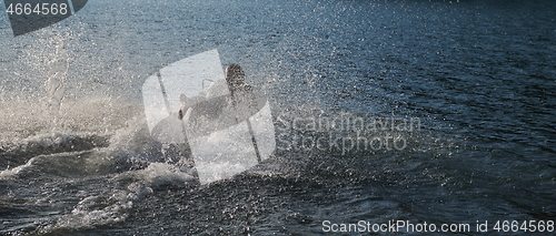 Image of triathlon athlete starting swimming training on lake