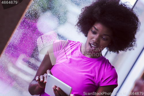 Image of african american woman using tablet