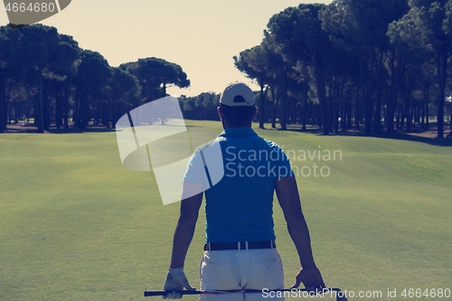 Image of golf player portrait from back