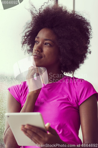 Image of african american woman using tablet