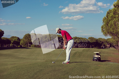 Image of golf player hitting long shot