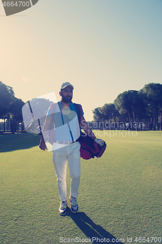 Image of golf player walking