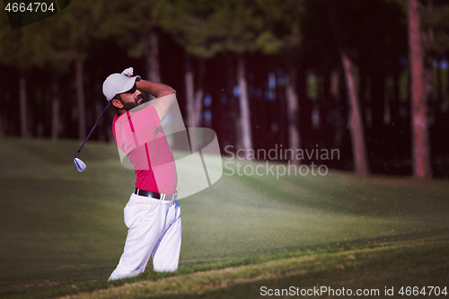 Image of golfer hitting a sand bunker shot