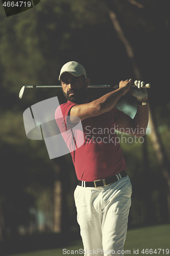 Image of golfer hitting a sand bunker shot