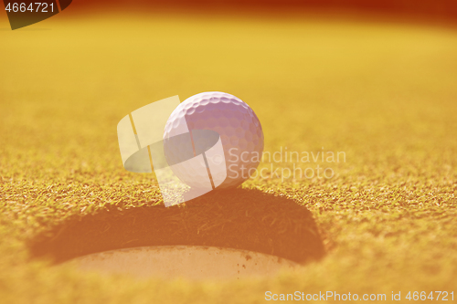 Image of golf ball in the hole