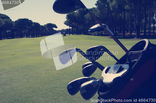 Image of close up golf bag on course