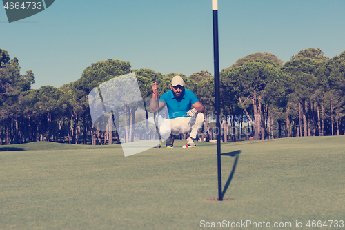 Image of golf player aiming perfect  shot