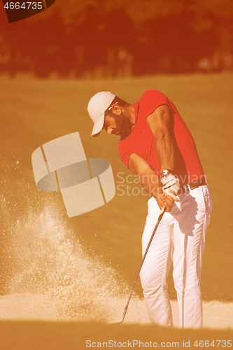 Image of golfer hitting a sand bunker shot