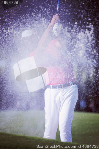 Image of golfer hitting a sand bunker shot